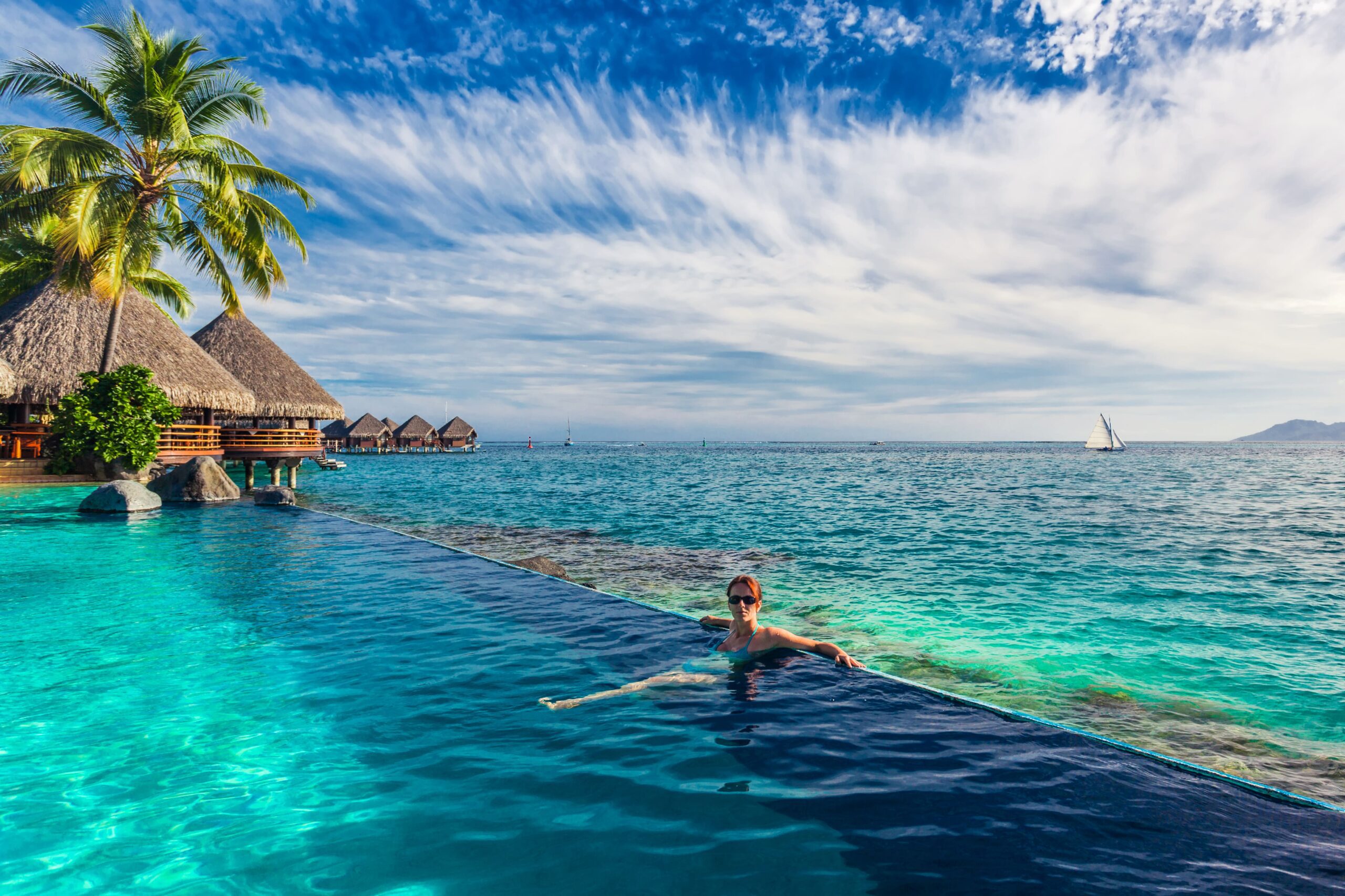 Woman In The Infinity Pool In Exotic Island Resort 2021 08 26 15 59 40 Utc Min Scaled